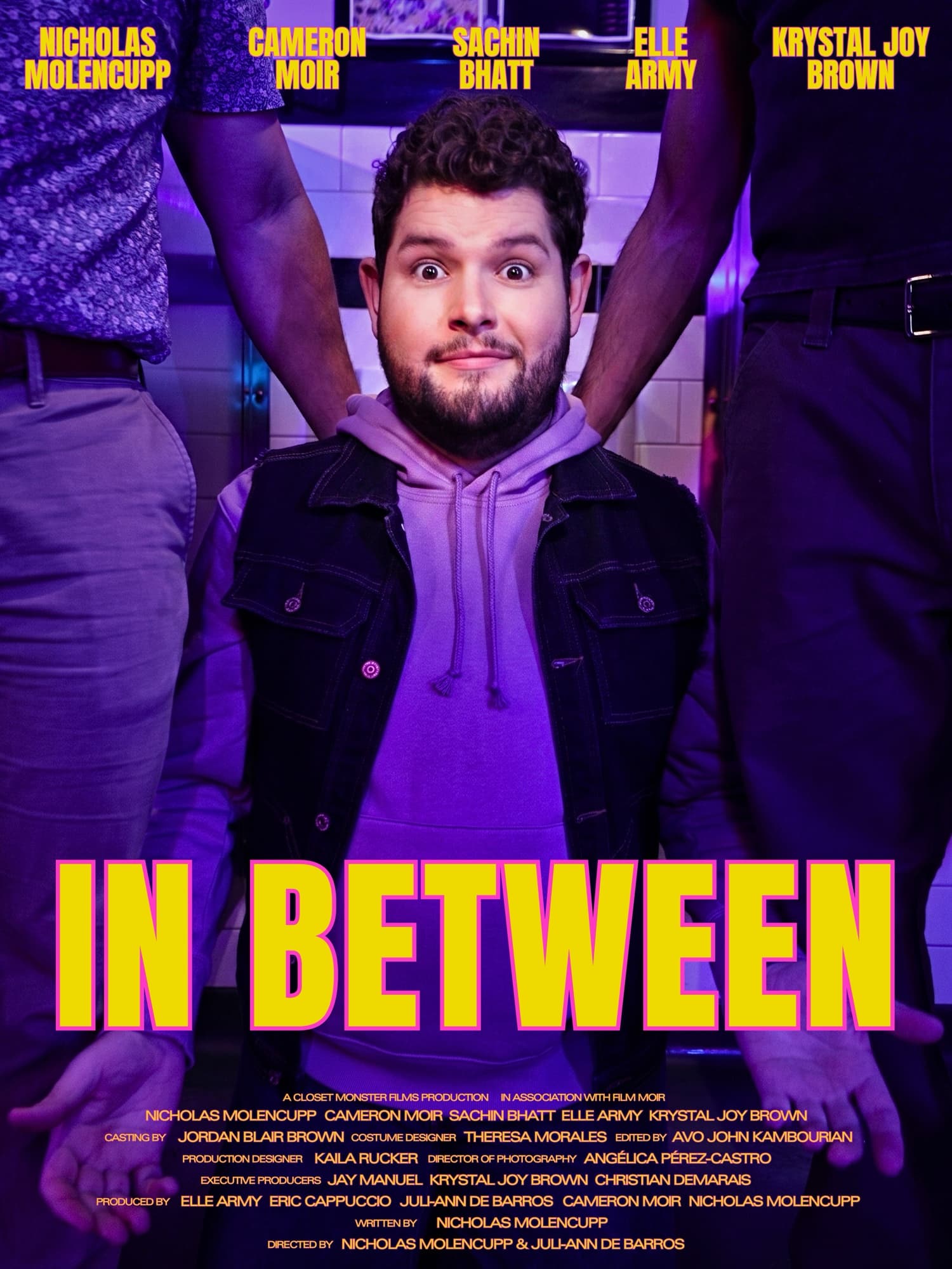 In Between, official movie poster. A queer romantic dramedy written and directed by Nicholas Molencupp, starring Cameron Moir, Sachin Bhatt, Elle Army, and Krystal Joy Brown.